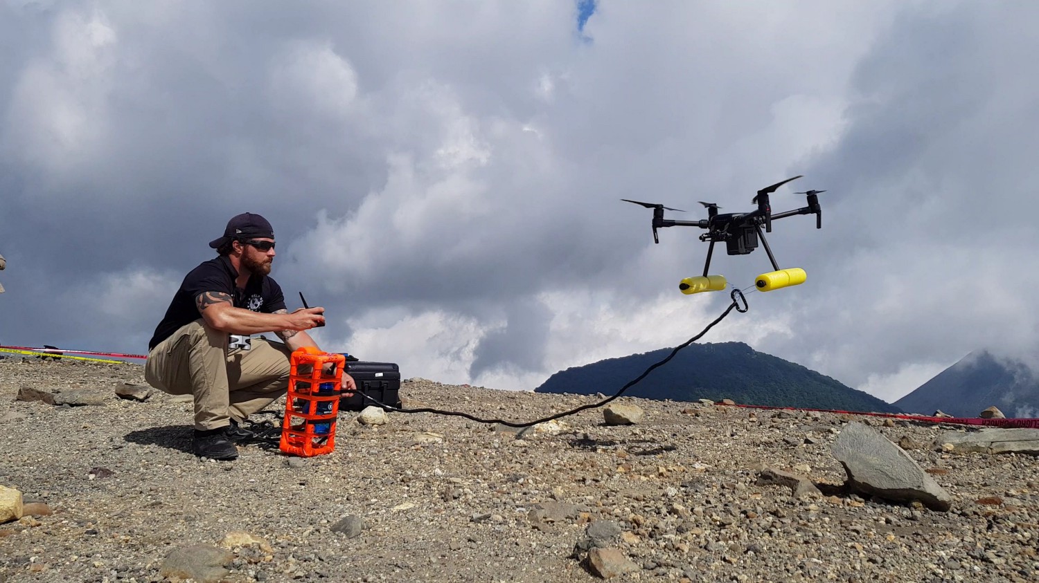 Expert on mission Clayton Covel readies a drone to collect a water sample from the crater of Santa Ana. Photo: WFP/Katarzyna Chojnacka