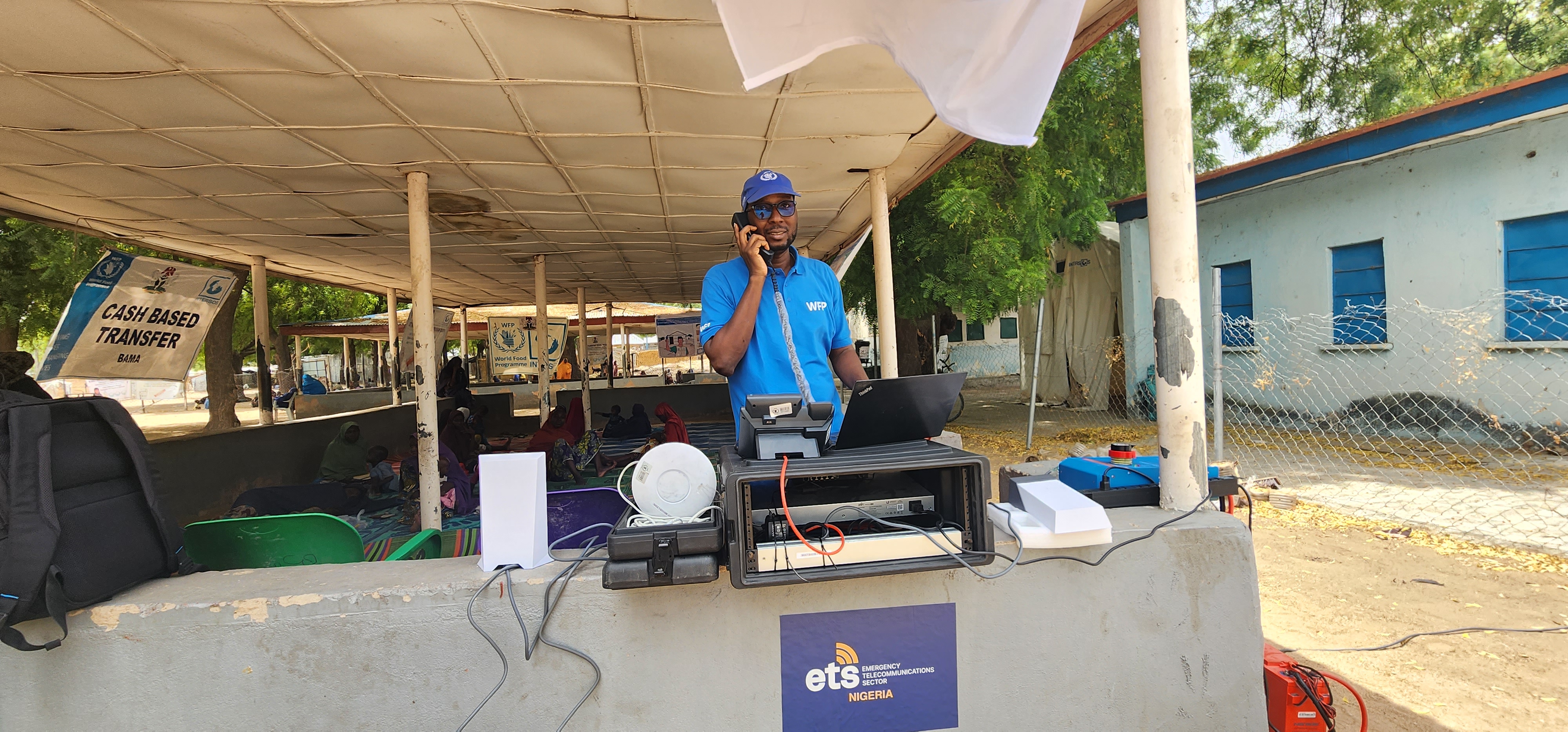WFP uses the CrisisNet kit to hold a call from the deep field. Photo credit: WFP/Caleb Anwara.