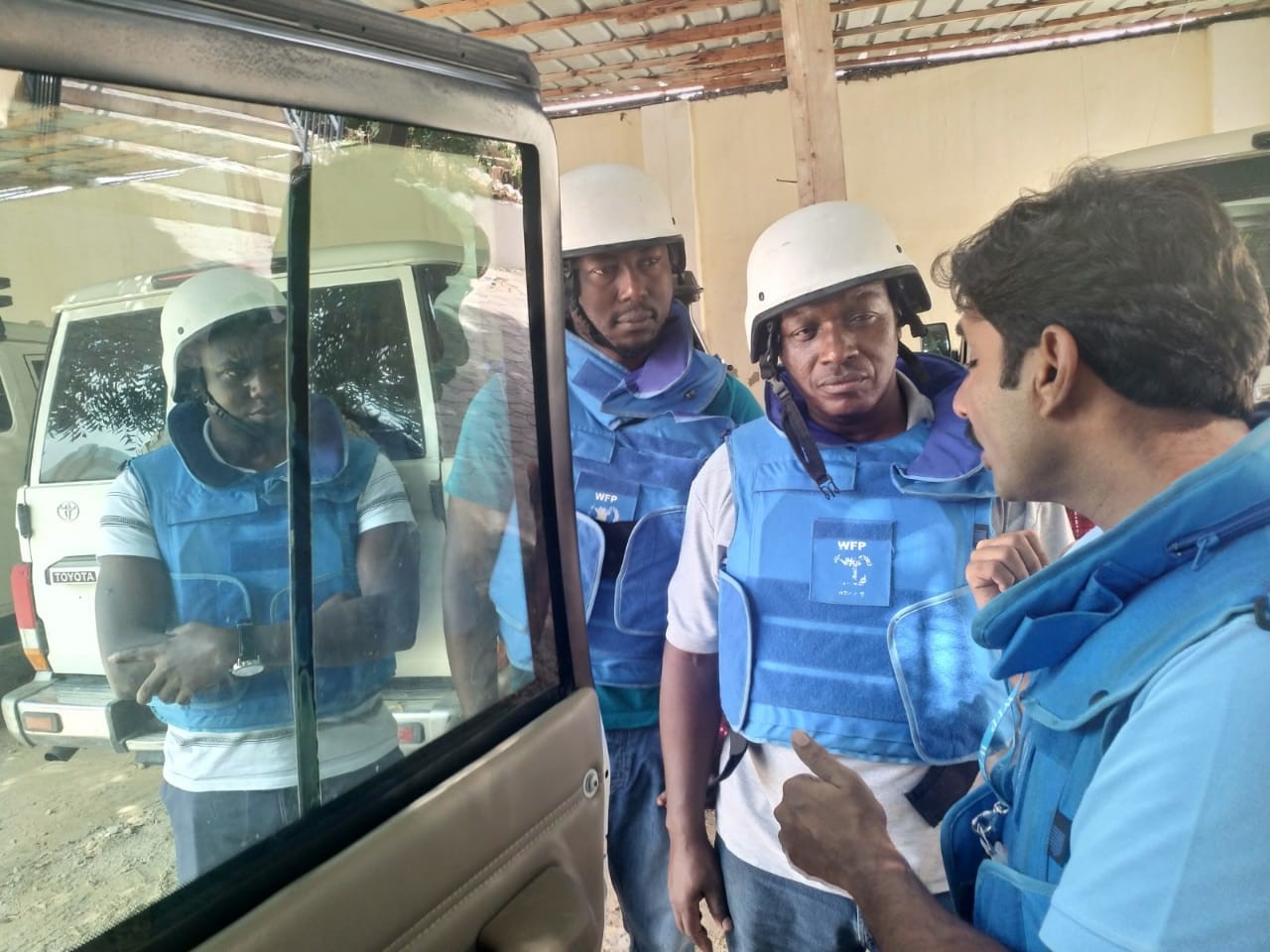 Amos Mwea, second from right, at a mission briefing in Mogadishu. Photo: WFP